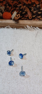 Set of four blue and white china-inspired cabochon decorative paper fasteners