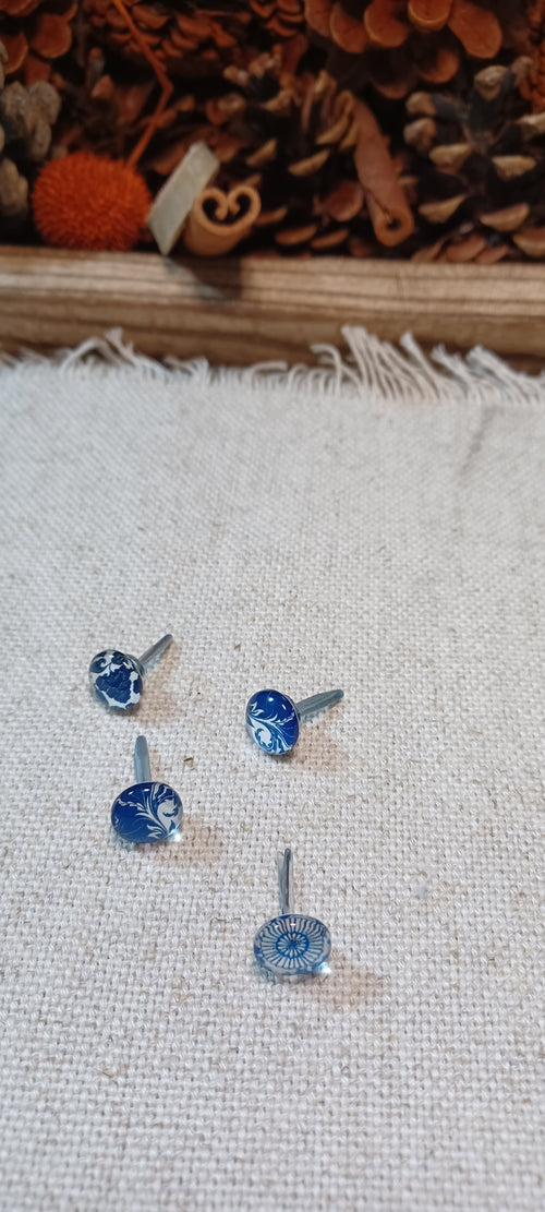 Set of four blue and white china-inspired cabochon decorative paper fasteners