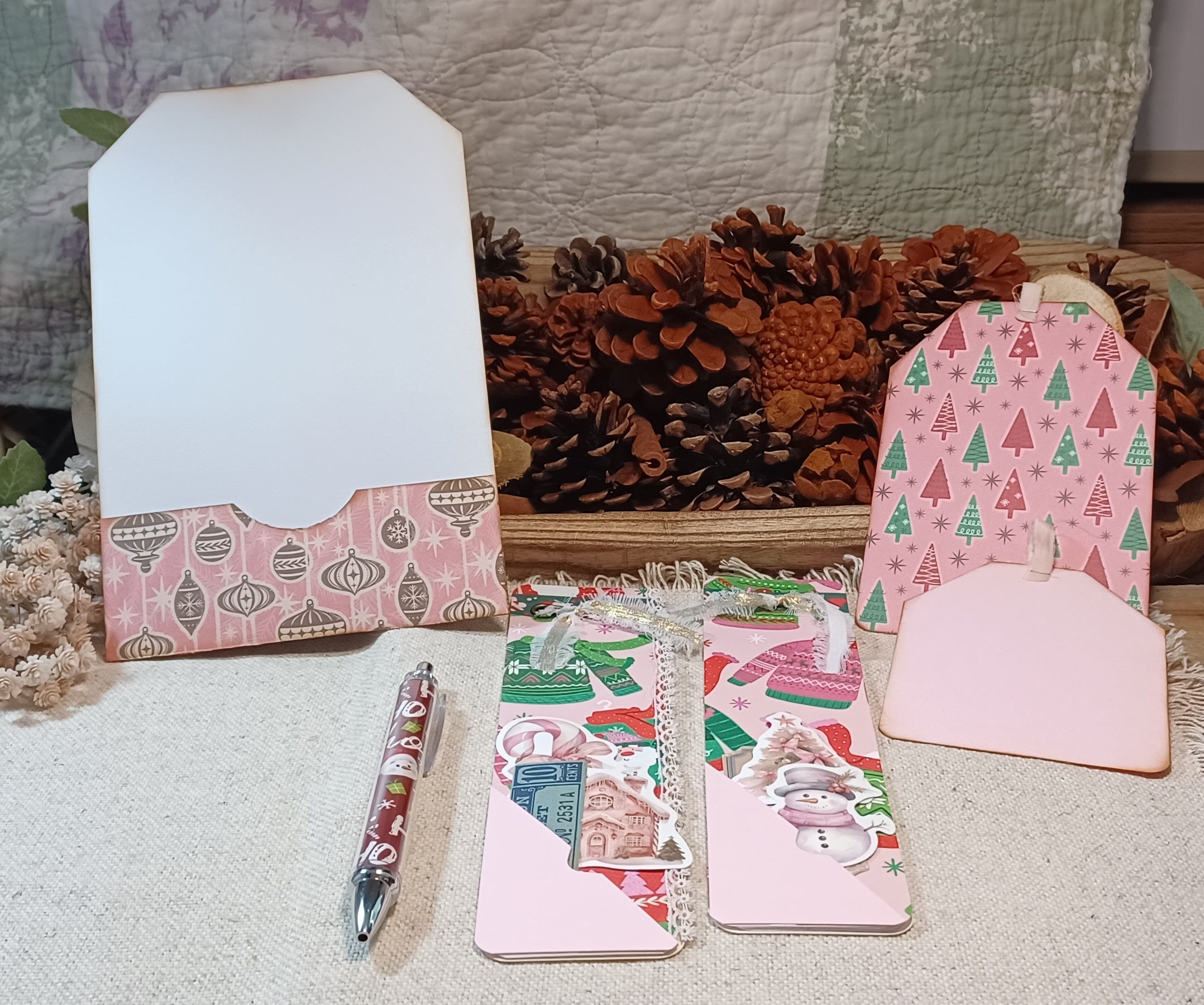 Pink Christmas notepads with handmade pockets, ribbon, lace and holiday ephemera