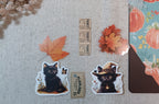 black cat autumn ephemera with vintage tickets and fall leaves