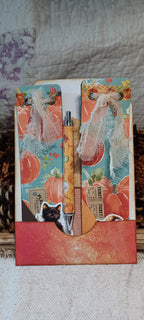 Handmade autumn mini journals with turquoise pumpkin covers and black cat ephemera