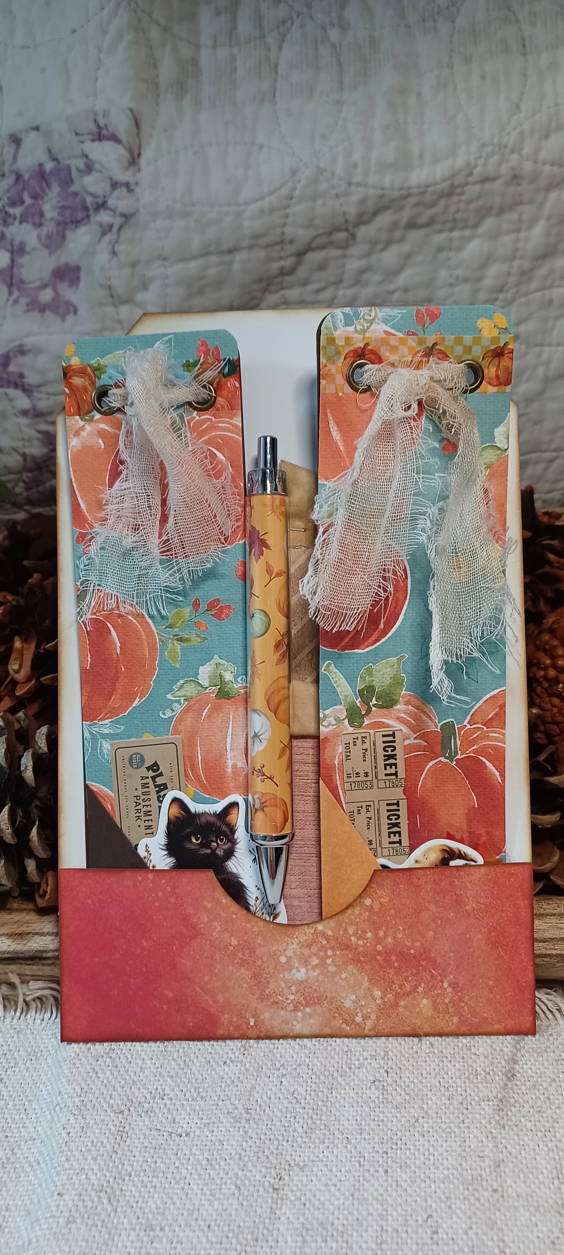 Handmade autumn mini journals with turquoise pumpkin covers and black cat ephemera
