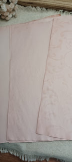 Avocado-dyed pale rose paper showing delicate hand-created stencil pattern