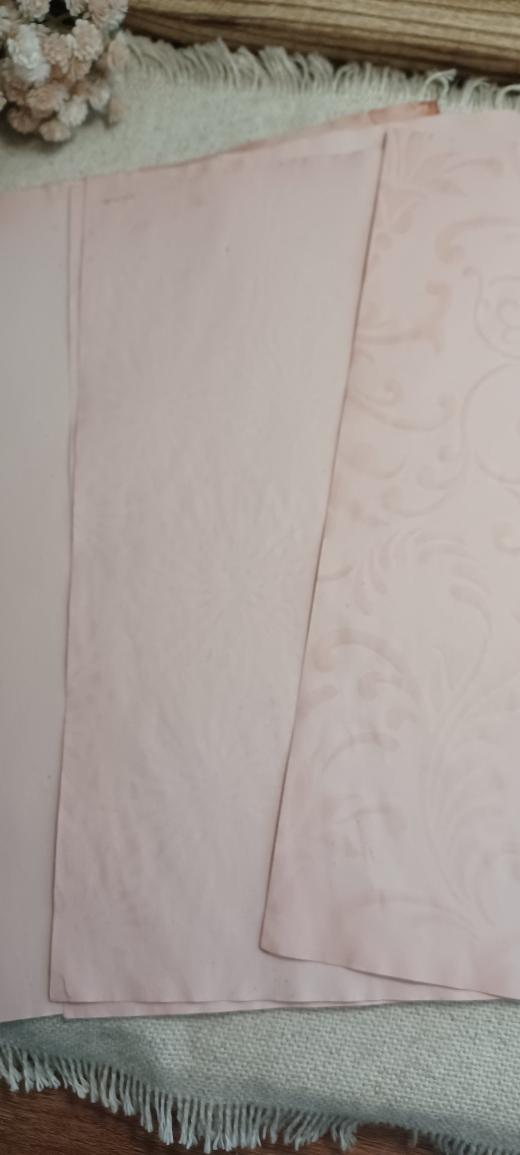 Avocado-dyed pale rose paper showing delicate hand-created stencil pattern