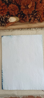 Hand dyed red cabbage paper showing softer natural blue variations and organic markings without a prominent stencil pattern