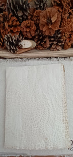 Tea-dyed paper showing hand-created stencil pattern and natural color variation