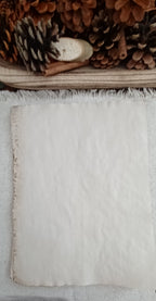 Coffee-dyed paper showing natural mottling and handmade tonal variation