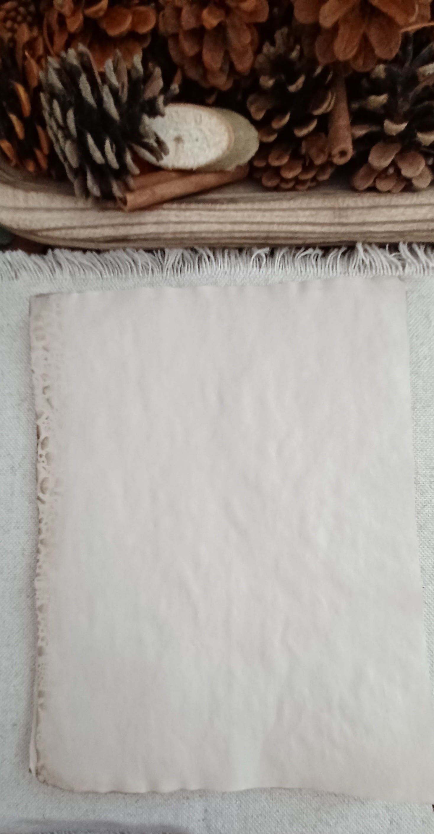 Coffee-dyed paper showing natural mottling and handmade tonal variation