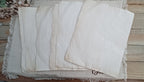 Assorted 8.5 by 11 inch naturally tea-dyed papers with varied tones and markings
