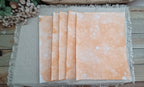 Five Dark Orange bubble-blown 8.5 x 11 paper sheets fanned out to show varied handmade bubble patterns