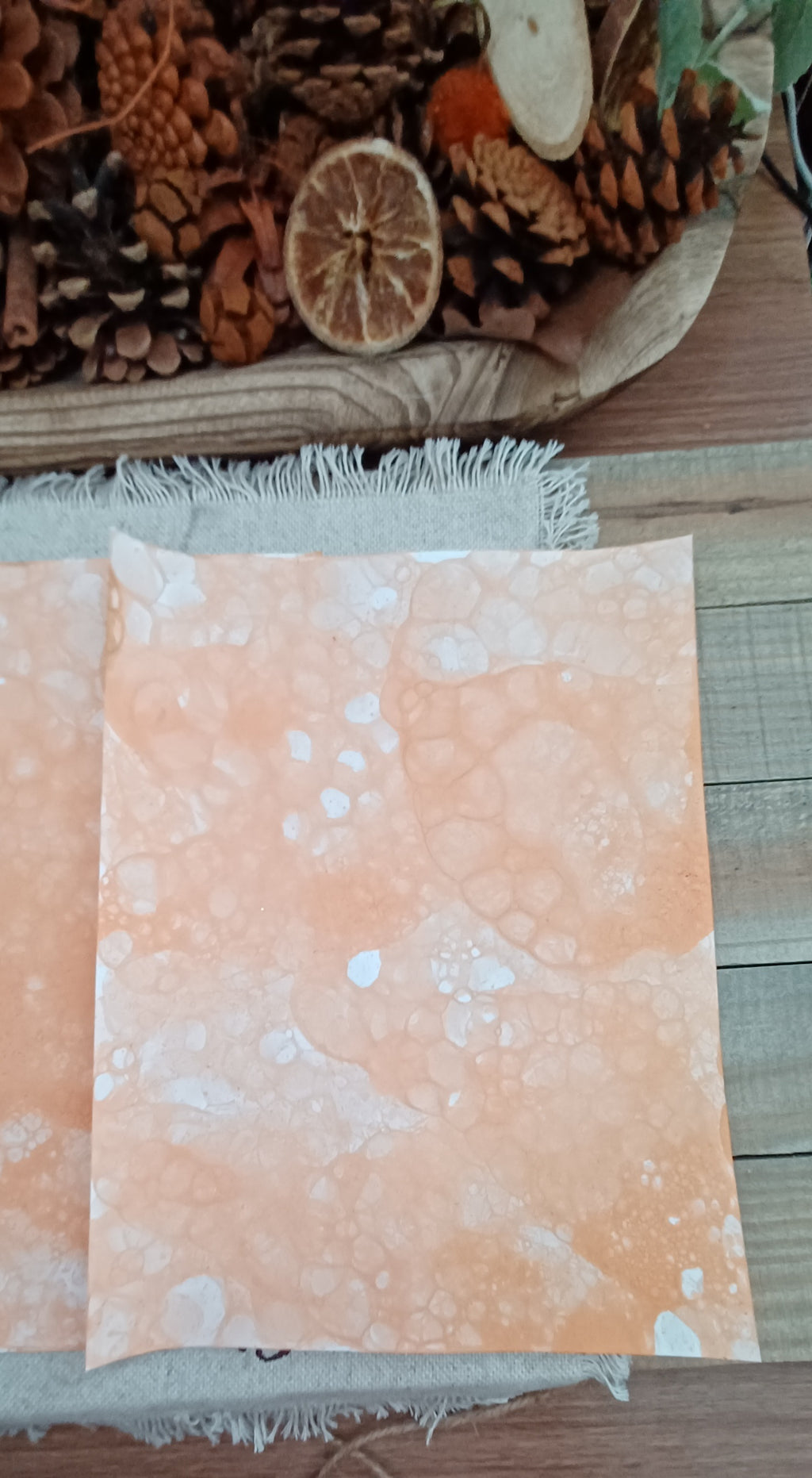 Dark Orange bubble-blown paper with varied circular markings, clustered bubbles, and handmade color variation
