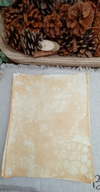 Mustard bubble-blown paper with delicate cellular patterns, pale open areas, and naturally overlapping bubble impressions
