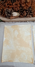 Handmade Mustard decorative paper featuring large and small organic bubble patterns across a warm golden background