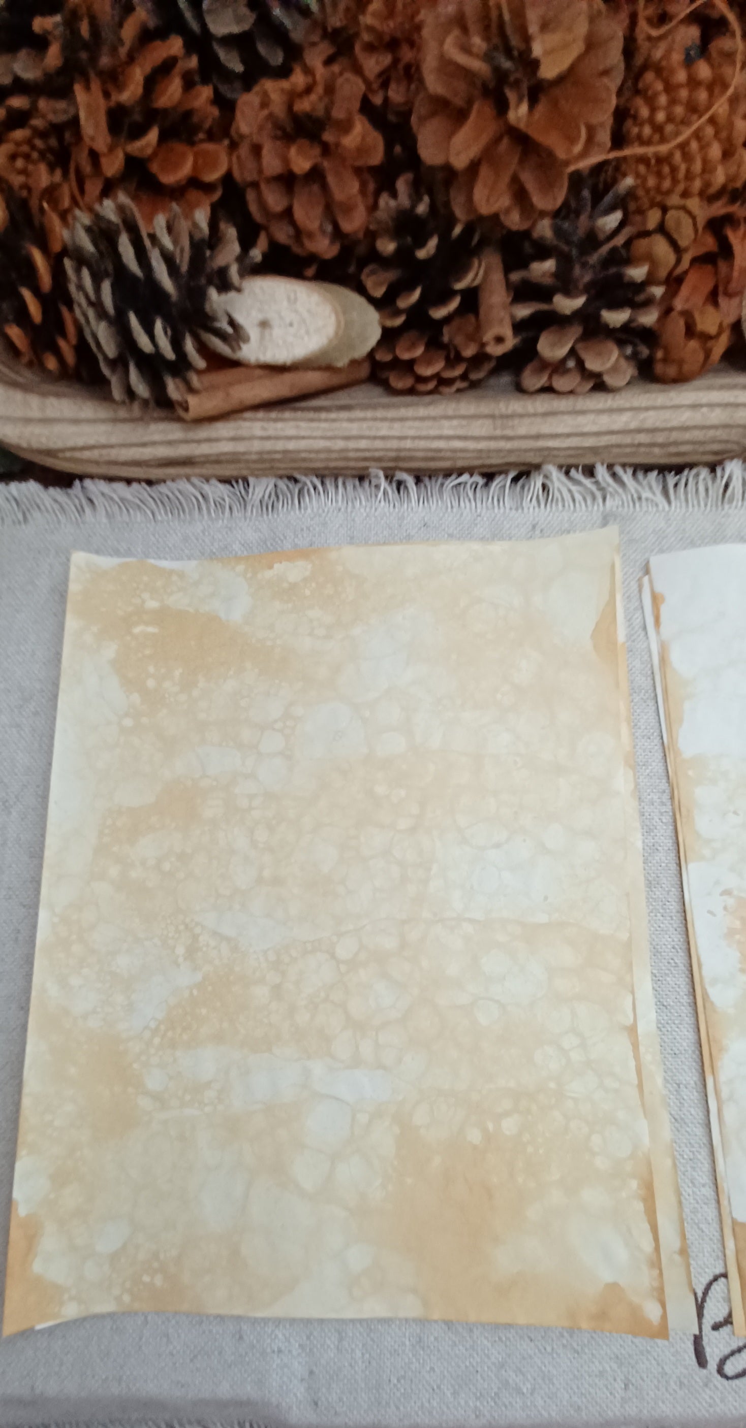 Mustard bubble-blown paper with delicate cellular patterns, pale open areas, and naturally overlapping bubble impressions