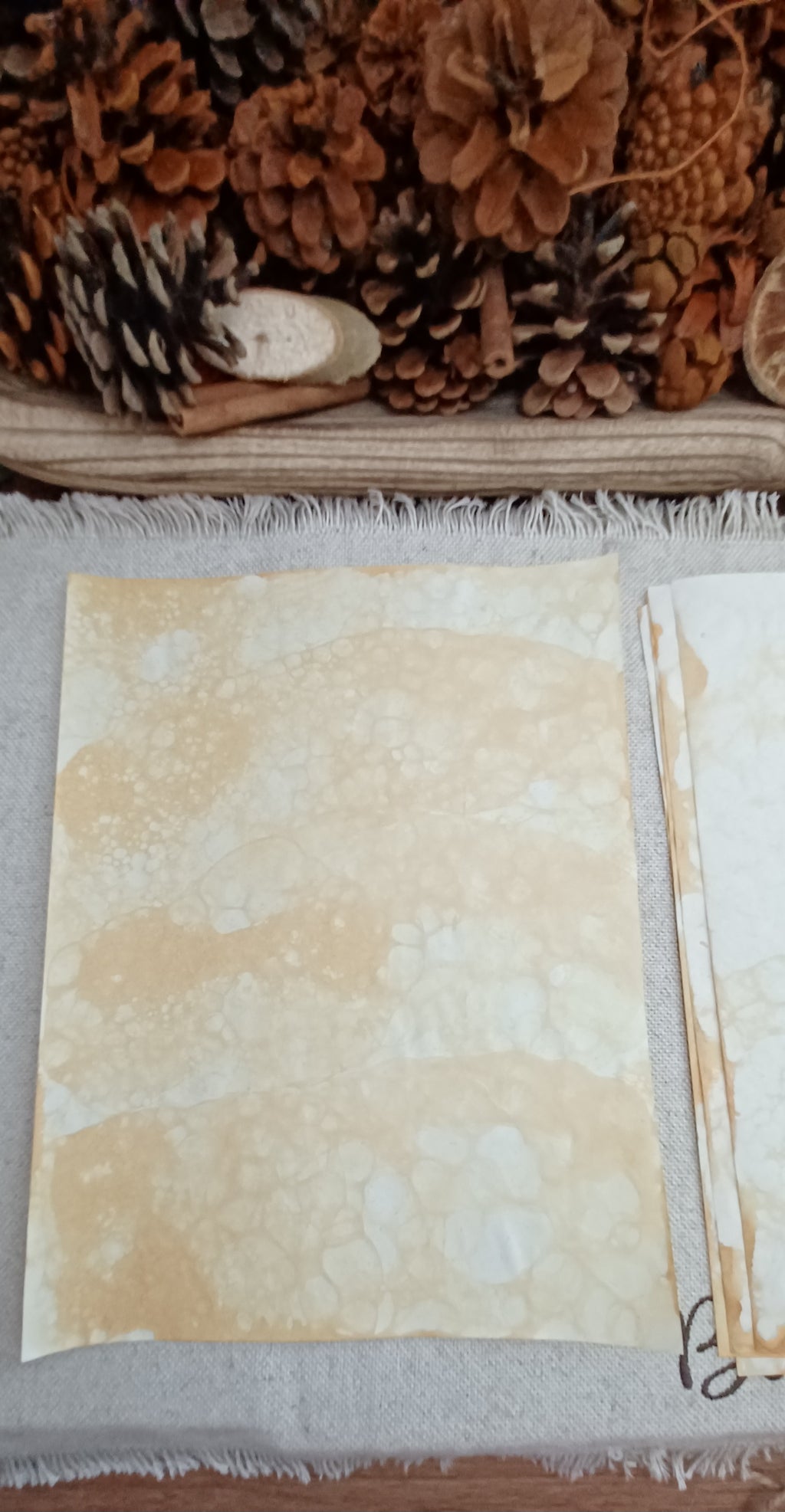 Handmade Mustard bubble paper with soft golden color, pale areas, and delicate naturally formed bubble markings