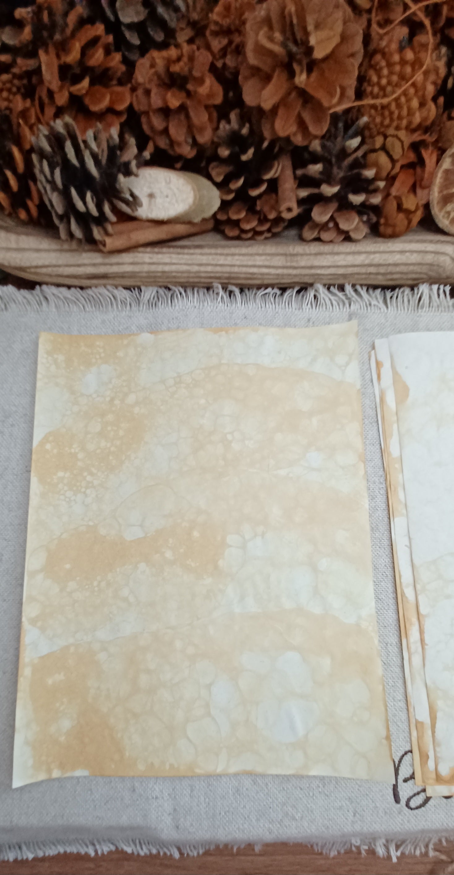 Handmade Mustard bubble paper with soft golden color, pale areas, and delicate naturally formed bubble markings