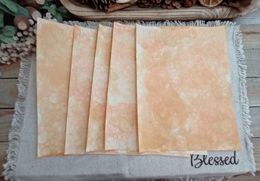 Five Orange and Mustard bubble-blown 8.5 x 11 decorative paper sheets fanned to show varied handmade patterns