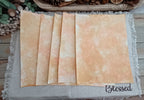 Five Orange and Mustard bubble-blown 8.5 x 11 decorative paper sheets fanned to show varied handmade patterns
