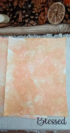 Handmade Orange and Mustard decorative paper with mottled warm color, pale areas, and overlapping bubble impressions