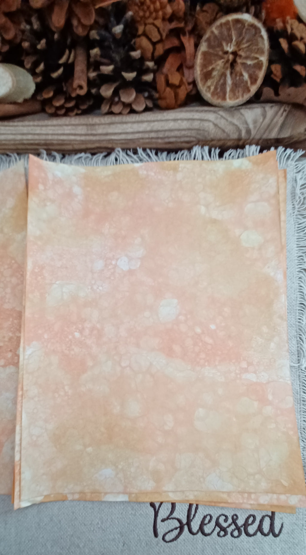 Handmade Orange and Mustard paper with soft blended color and subtle organic patterns created by blown bubbles