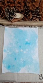 Handmade Light Blue bubble art paper showing brighter aqua areas, overlapping circles, and organic bubble patterns