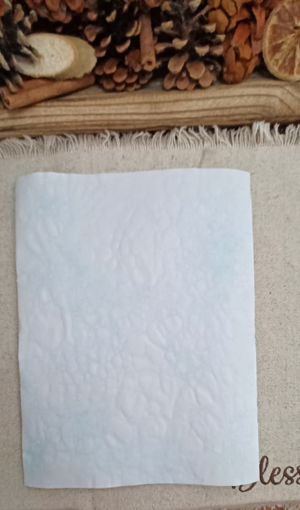 Handmade Light Blue back side of the decorative paper featuring showing a very pale blue bubble networks and naturally varied pattern placement and the texture of the paper