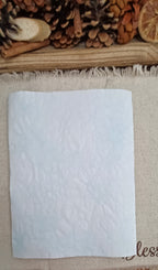 Handmade Light Blue back side of the decorative paper featuring showing a very pale blue bubble networks and naturally varied pattern placement and the texture of the paper