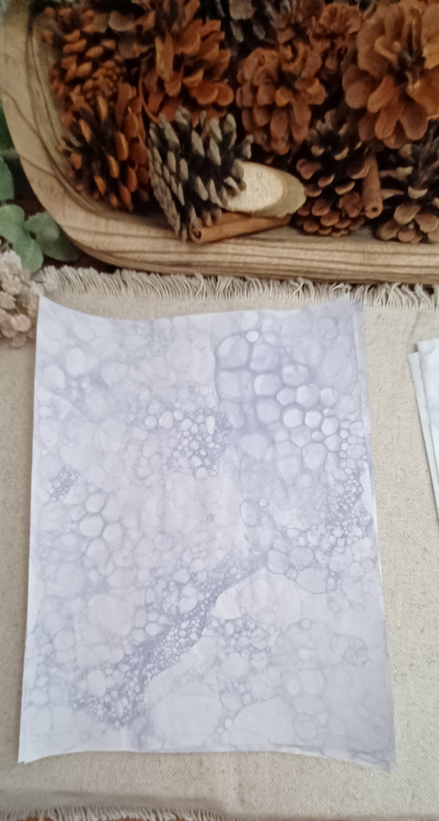 Purple bubble art paper featuring clustered cellular patterns, overlapping circles, and softly colored open areas