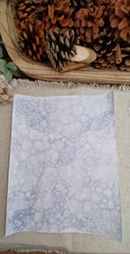 Purple bubble-blown decorative paper with large circular impressions and clusters of smaller overlapping bubbles
