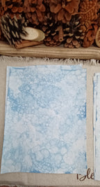Lightly patterned Denim Blue bubble-blown paper showing open areas and delicate blue bubble markings
