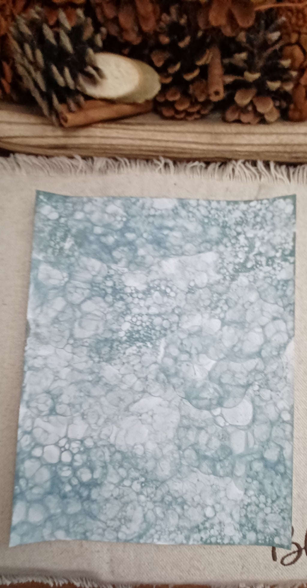 Handmade Green decorative paper showing varied bubble sizes, overlapping circles, and organic patterned areas