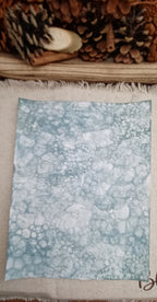 Handmade Green decorative paper showing varied bubble sizes, overlapping circles, and organic patterned areas