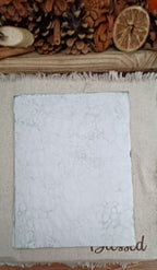 Subtly patterned Green bubble-blown paper showing very pale coloring on the back side of the sheets  and delicate handmade bubble impressions that give the paper the unique texture