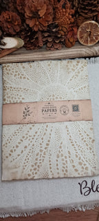 Naturally coffee-dyed paper showing detailed stencil pattern and organic color variation