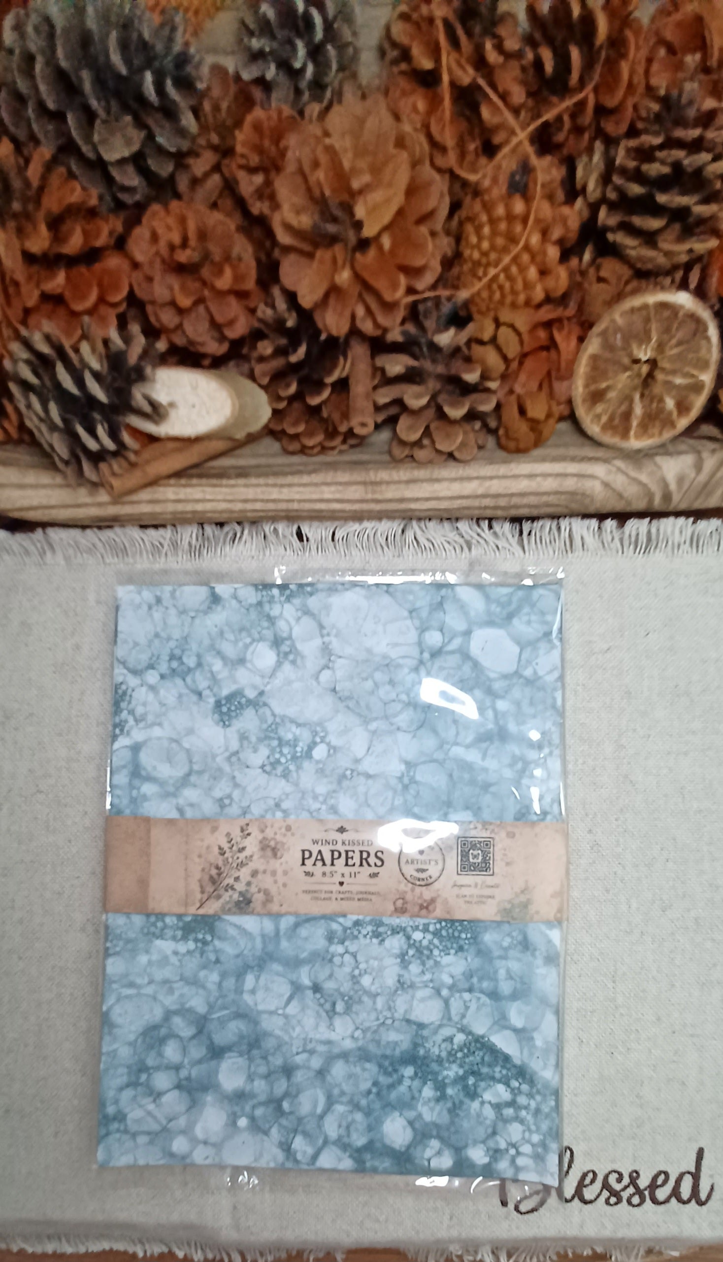 Coordinating set of five Green bubble-blown decorative papers wrapped with a Butterfly in the Attic paper band in plastic