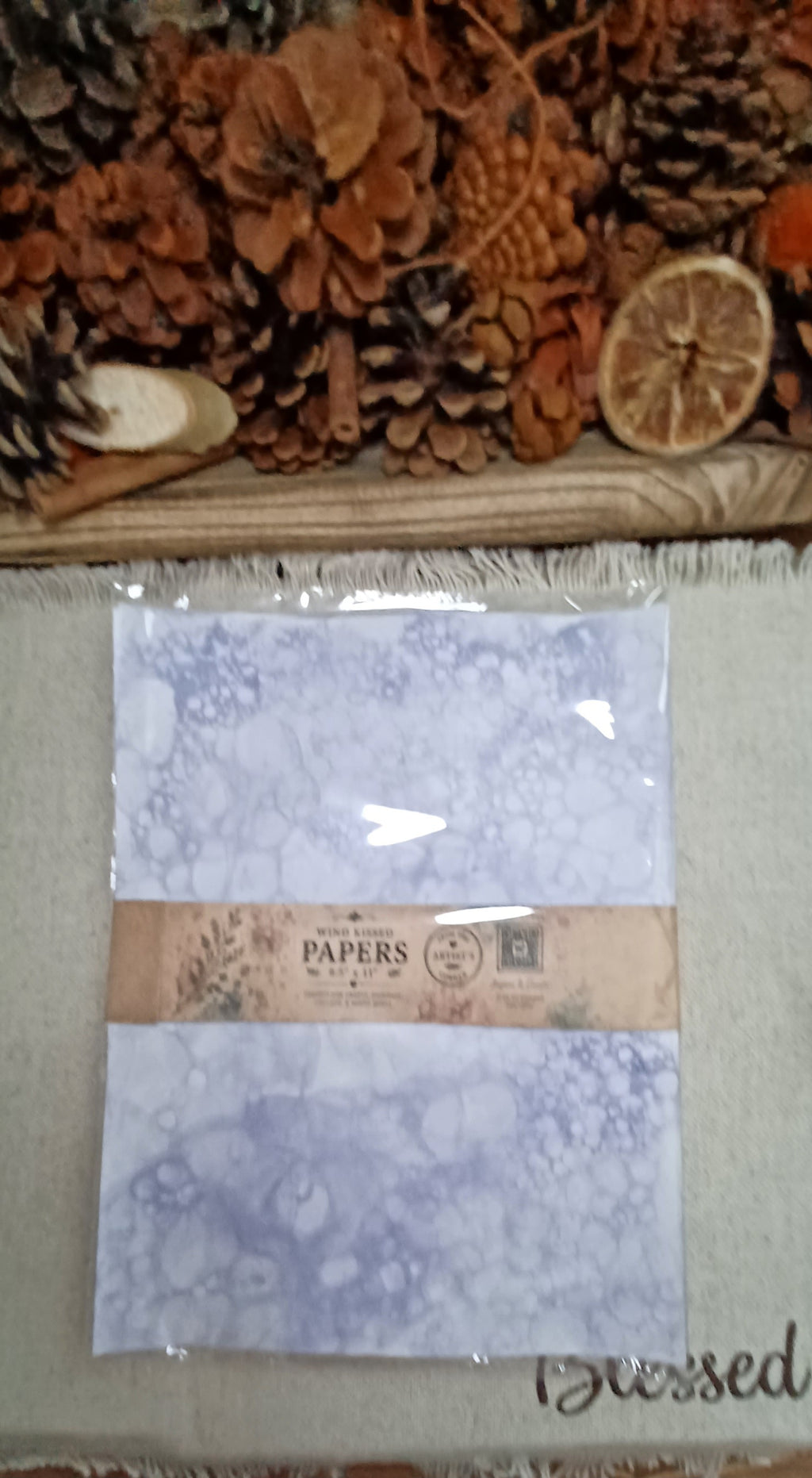 Coordinating set of five Purple bubble-blown decorative papers wrapped with a decorative paper product band and plastic bag
