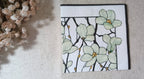 Sage green floral cocktail paper napkin with black botanical branches and golden accents for decoupage, collage and paper crafts.