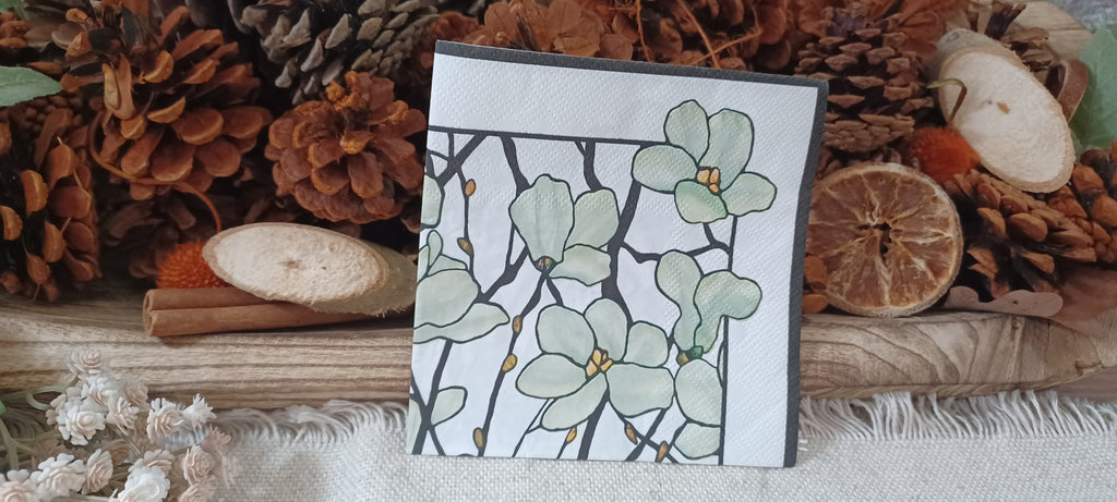 Sage green floral cocktail paper napkin with black botanical branches and golden accents for decoupage, collage and paper crafts.