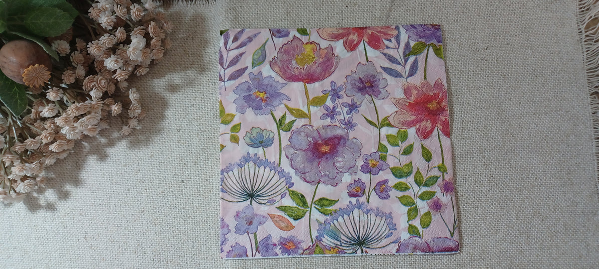 Watercolor spring garden floral paper napkin with pink, lavender, blue and green flowers for decoupage and paper crafts.