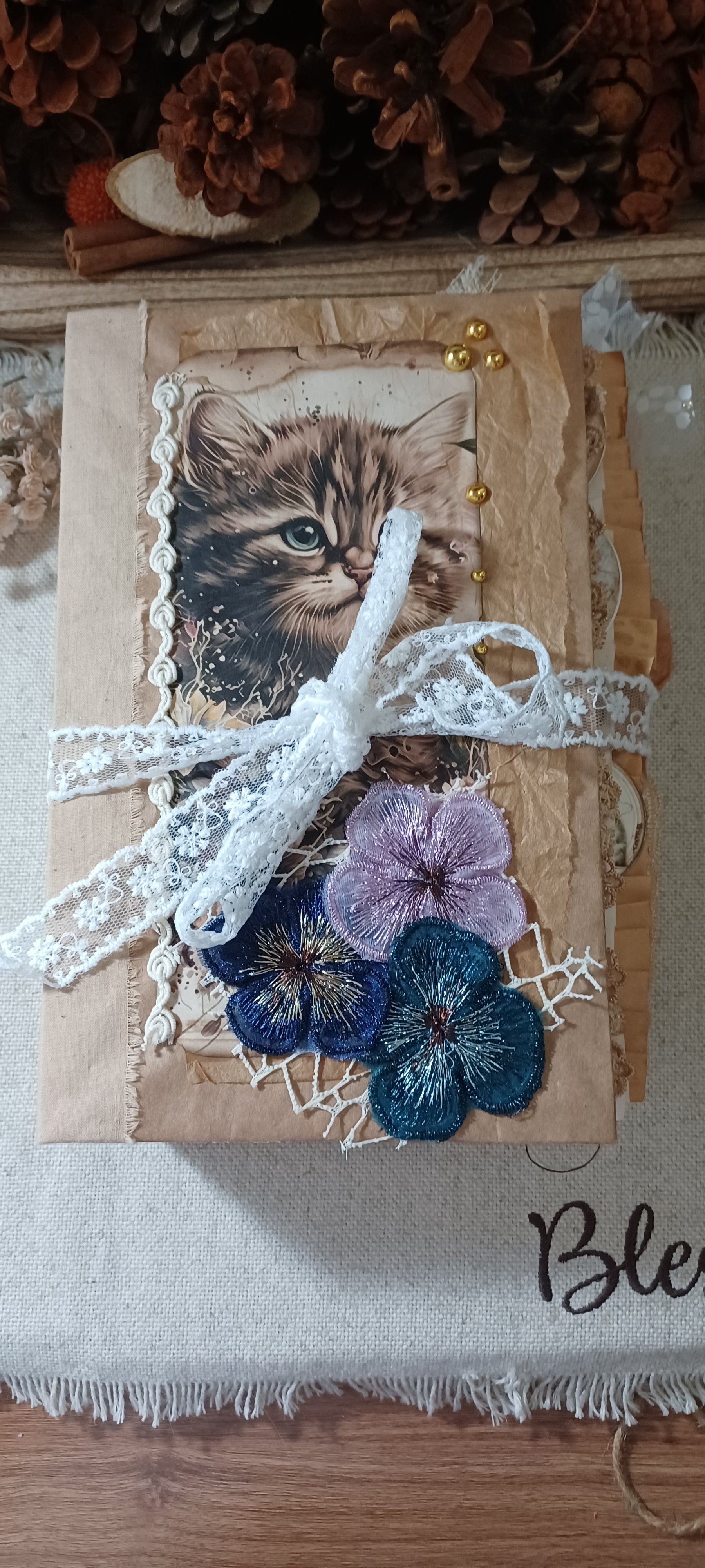 Whiskers & Lace handmade cat junk journal with vintage kitten imagery, flowers, lace and ribbon details.