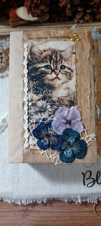 Whiskers & Lace handmade cat junk journal with vintage kitten imagery, flowers, lace and ribbon details.