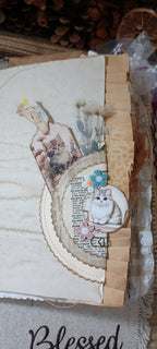 White kitten feature page inside romantic vintage-style handmade cat junk journal.