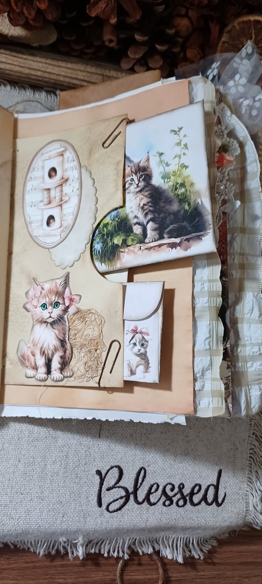 Handmade pocket and removable ephemera inside vintage-style cat and kitten junk journal.