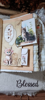 Handmade pocket and removable ephemera inside vintage-style cat and kitten junk journal.