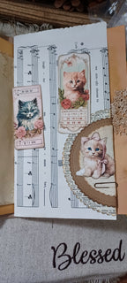 Pocket with removable journaling card inside handmade cat journal with tea and coffee dyed papers.