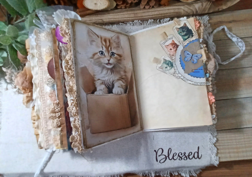 Cat-themed handmade journal page combining vintage kitten imagery with space for personal writing.