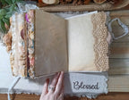 Tea and coffee dyed journal paper providing open writing space inside the handmade cat junk journal.