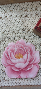Pink die-cut floral luncheon napkin displayed on vintage crochet lace for decoupage and paper crafts.