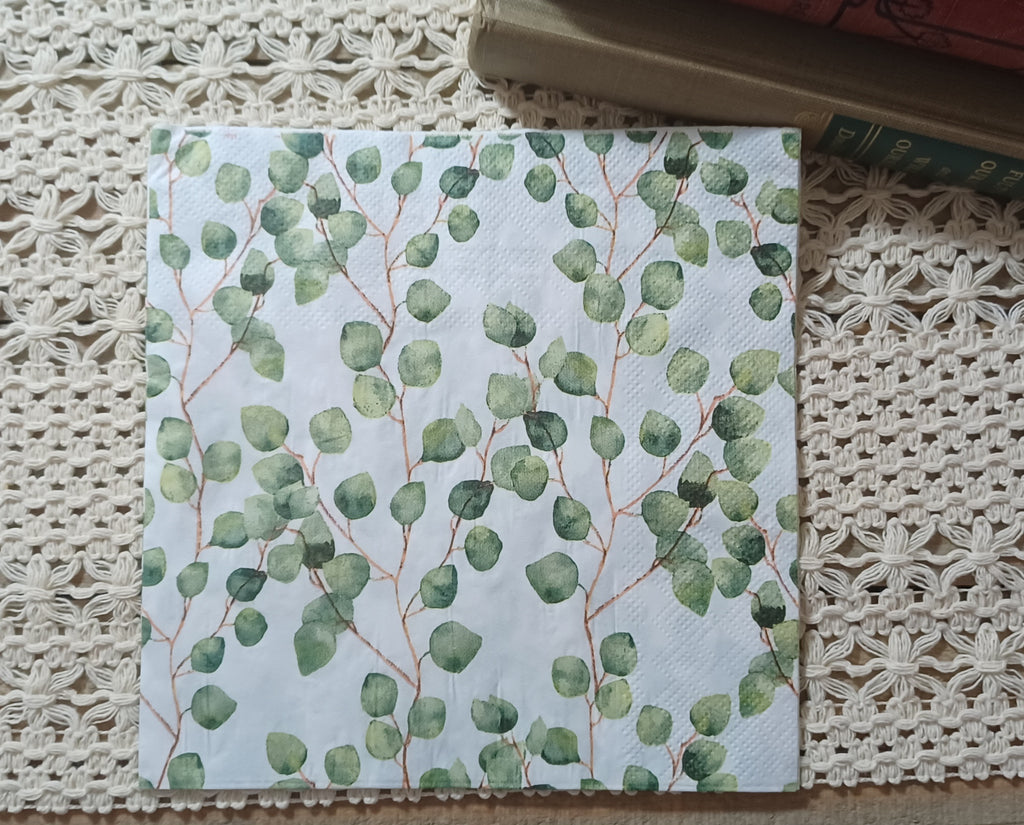 Full botanical decoupage napkin with repeating watercolor eucalyptus leaves in soft sage and green.