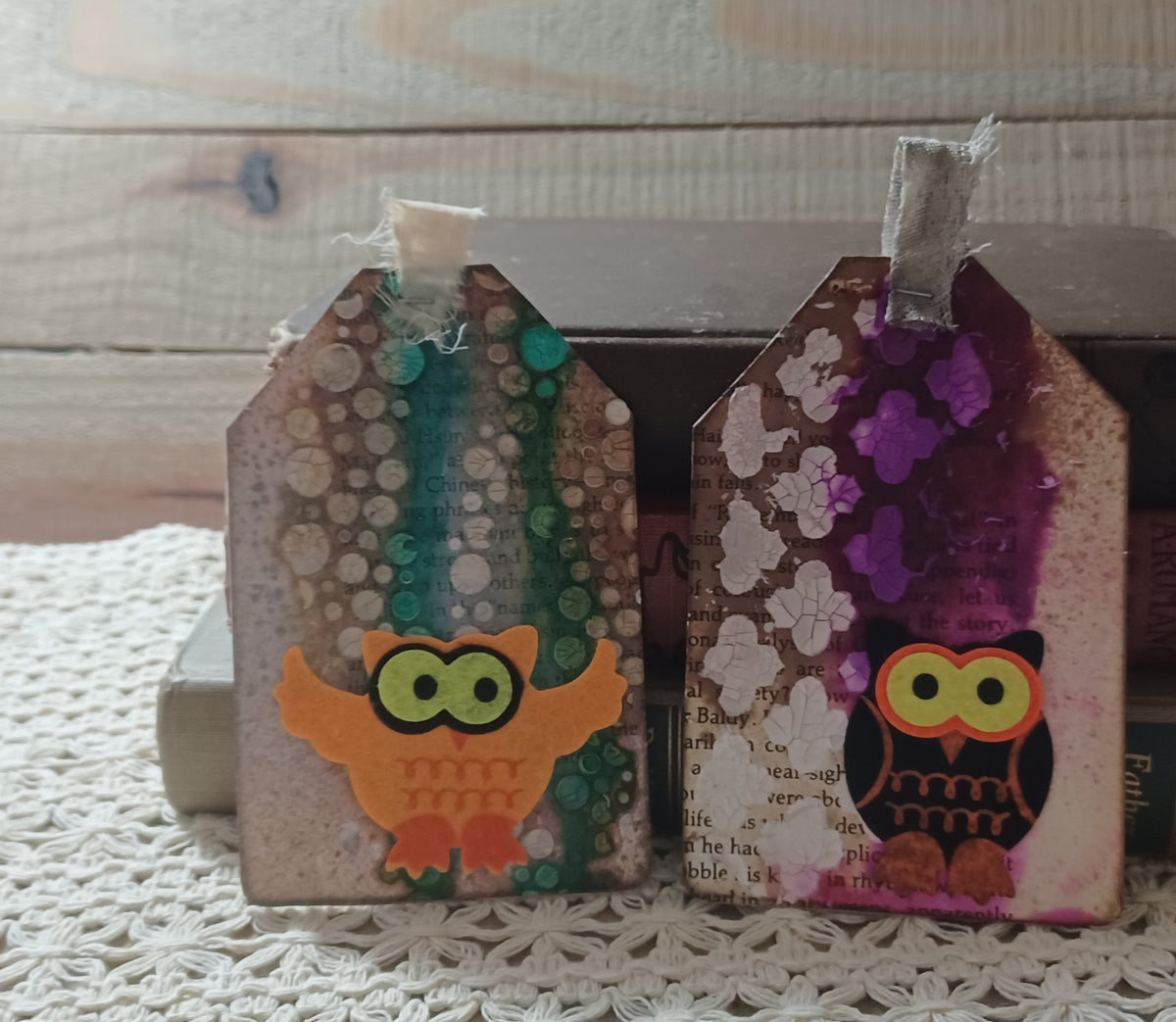 Orange and black owl journal tags layered over vintage book text with teal, purple and crackled ivory texture